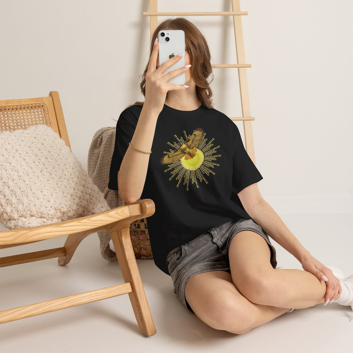 T-shirt featuring a photograph of a Flying Red-tailed Hawk in front of a Sun Patterned Design!
