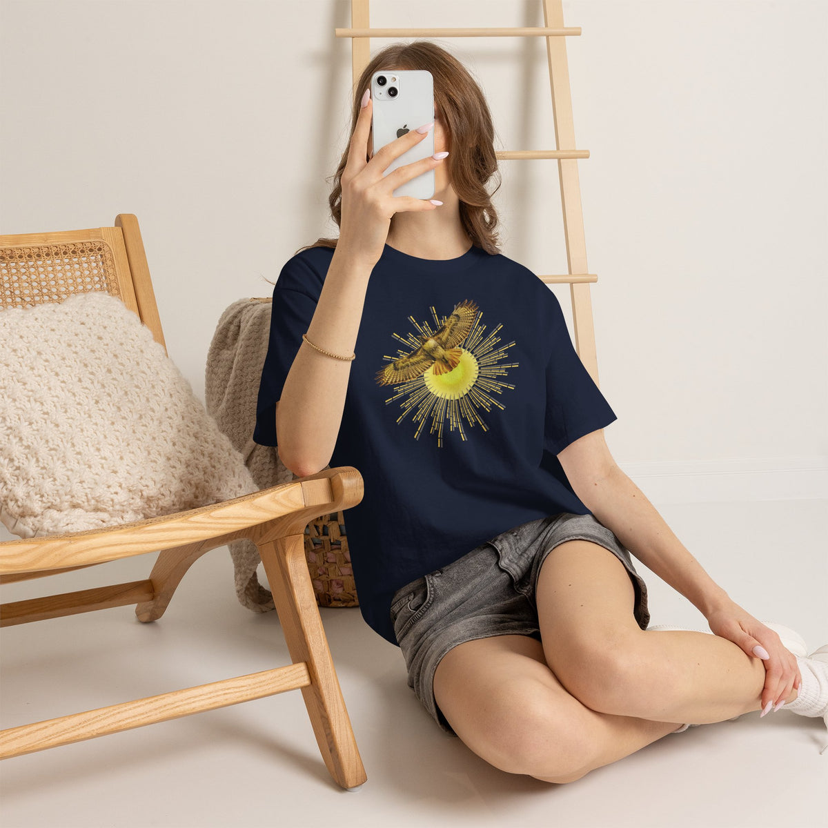 T-shirt featuring a photograph of a Flying Red-tailed Hawk in front of a Sun Patterned Design!